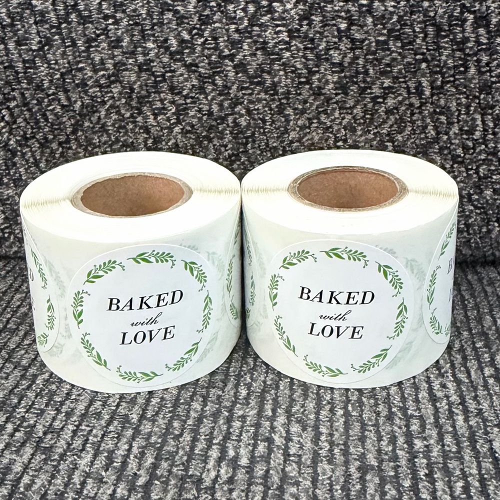 2 rolls of stickers “baked with love” 1.5in